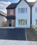 A social housing development in Ballymakenny Road, Drogheda, Co Louth consisting of 50 houses of 3 and 4 bed dwellings along with large green areas planted with native trees and plants. red brick facade