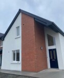 A social housing development in Ballymakenny Road, Drogheda, Co Louth consisting of 50 houses of 3 and 4 bed dwellings along with large green areas planted with native trees and plants. red brick house